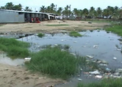 Houses and a dirty pond